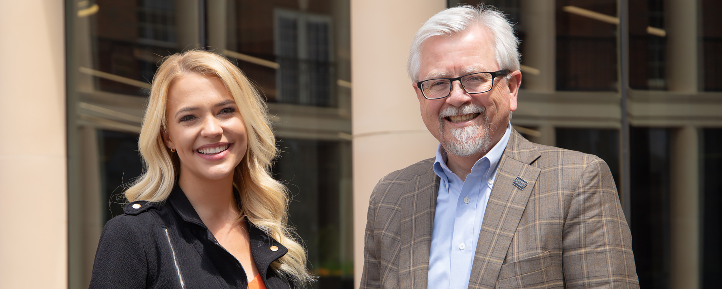 Addison Price and Dean Eastman in the Business Building courtyard. 