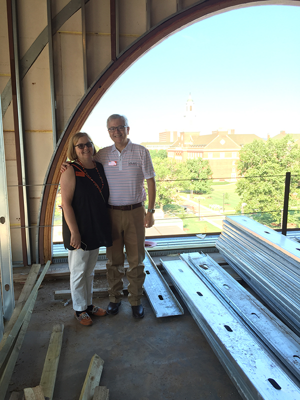 The Eastmans touring the Business Building under construction