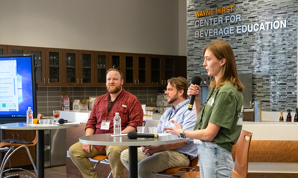 A student leads a discussion at the Craft Beer Forum.