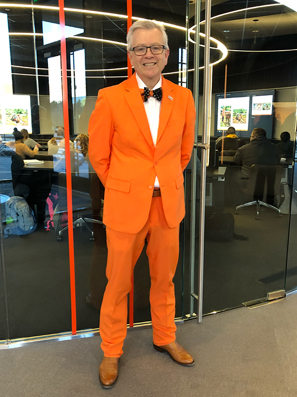 Dr Eastman in an orange suit