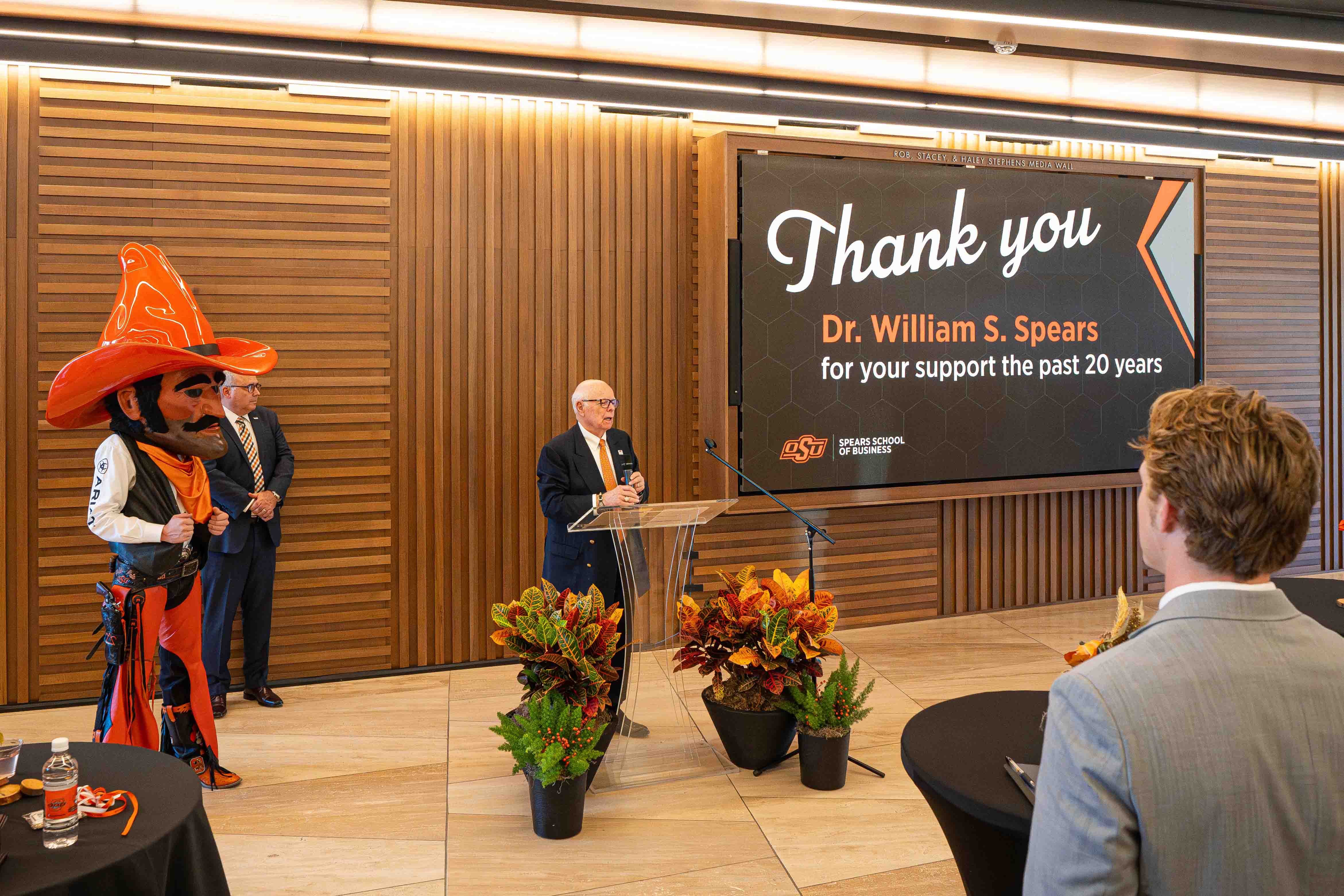 Dr. Spears speaking at a podium in the Keystone Lobby