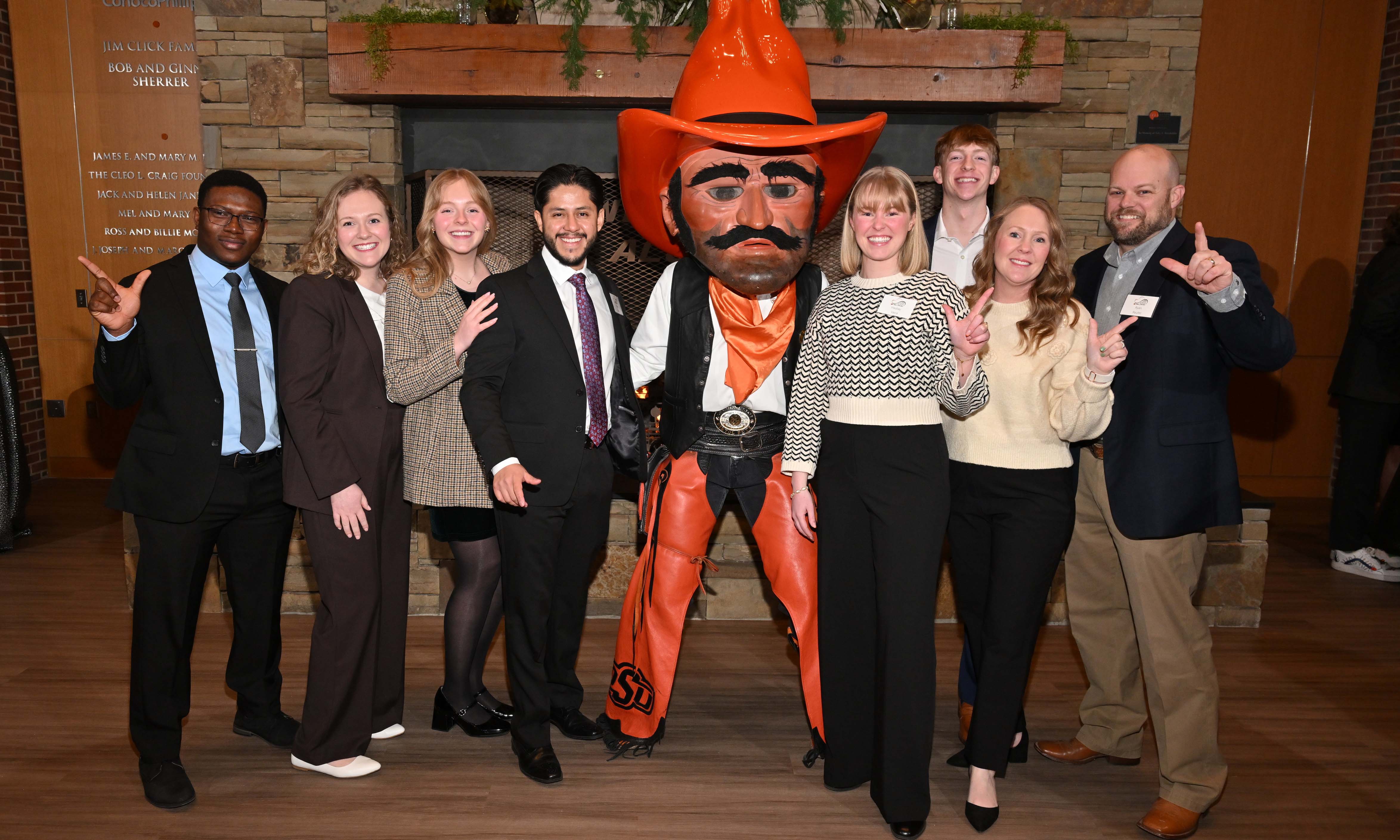 Alumna and family posing with Pistol Pete Alumna and family posing with Pistol Pete