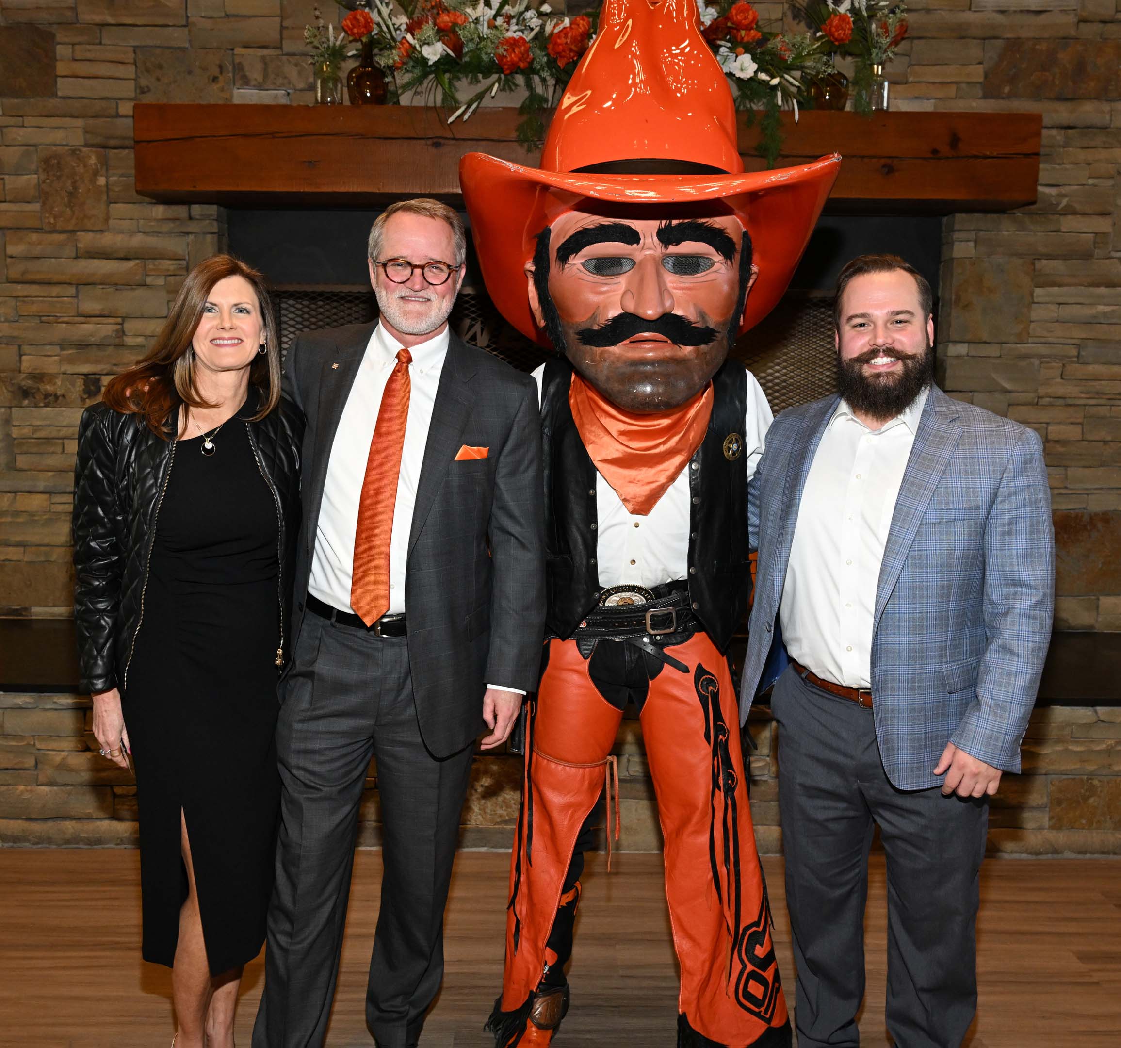 Alumni standing with Pistol Pete Alumni standing with Pistol Pete