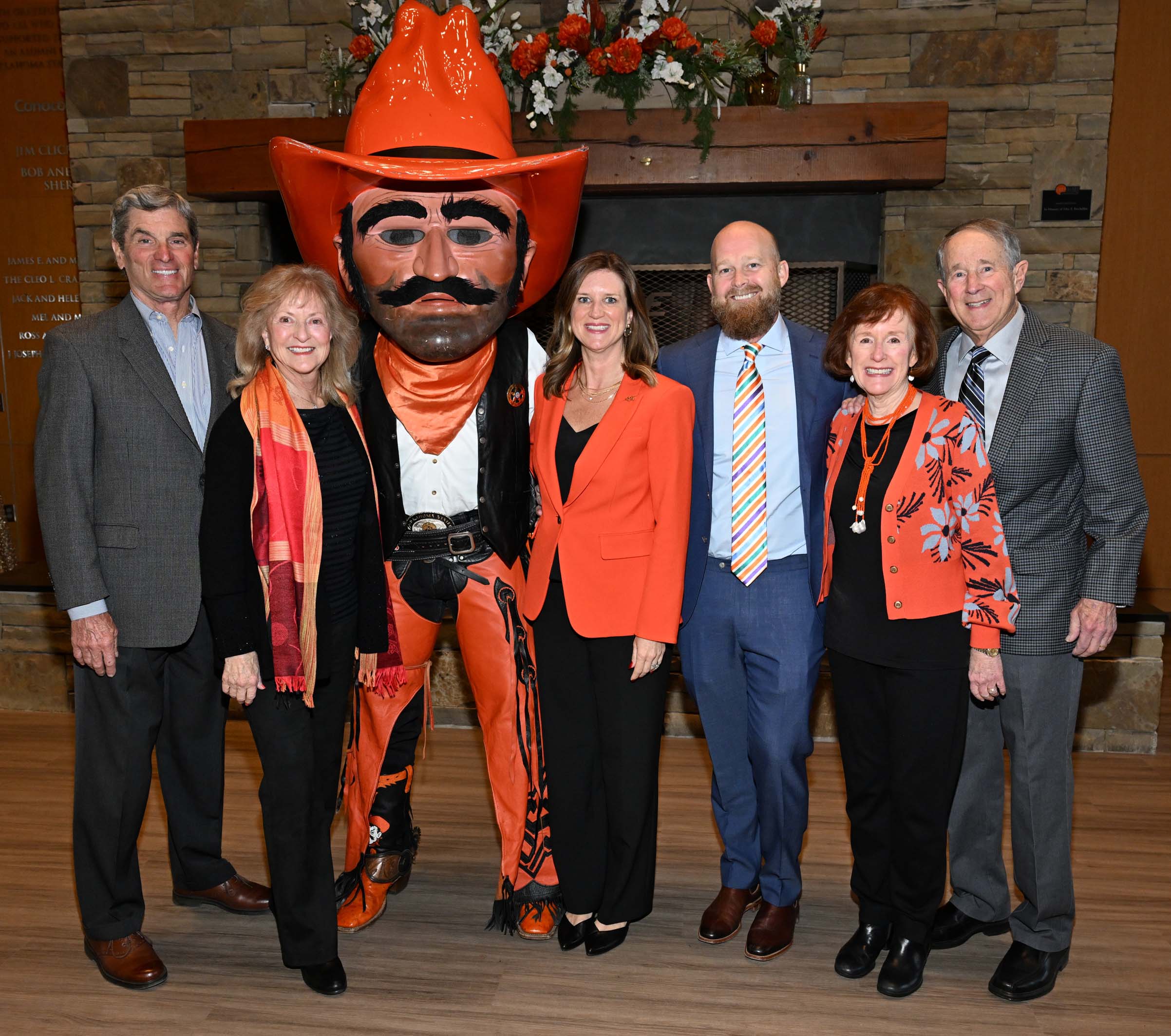Alumni and family standing with Pistol Pete Alumni and family standing with Pistol Pete
