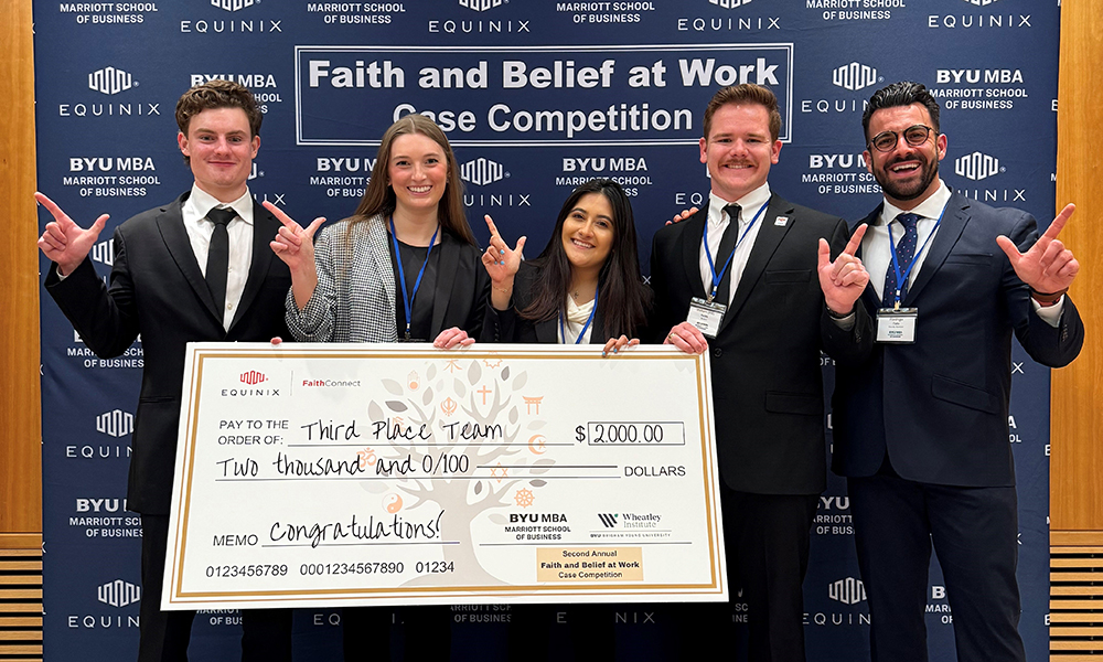 MBA case competition participants posing with their winnings.