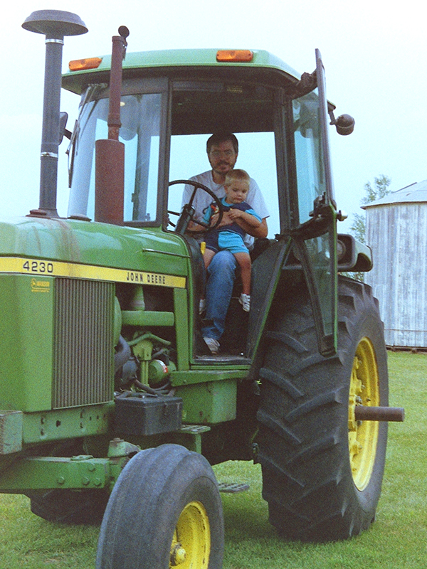 Riding in a tractor with his son